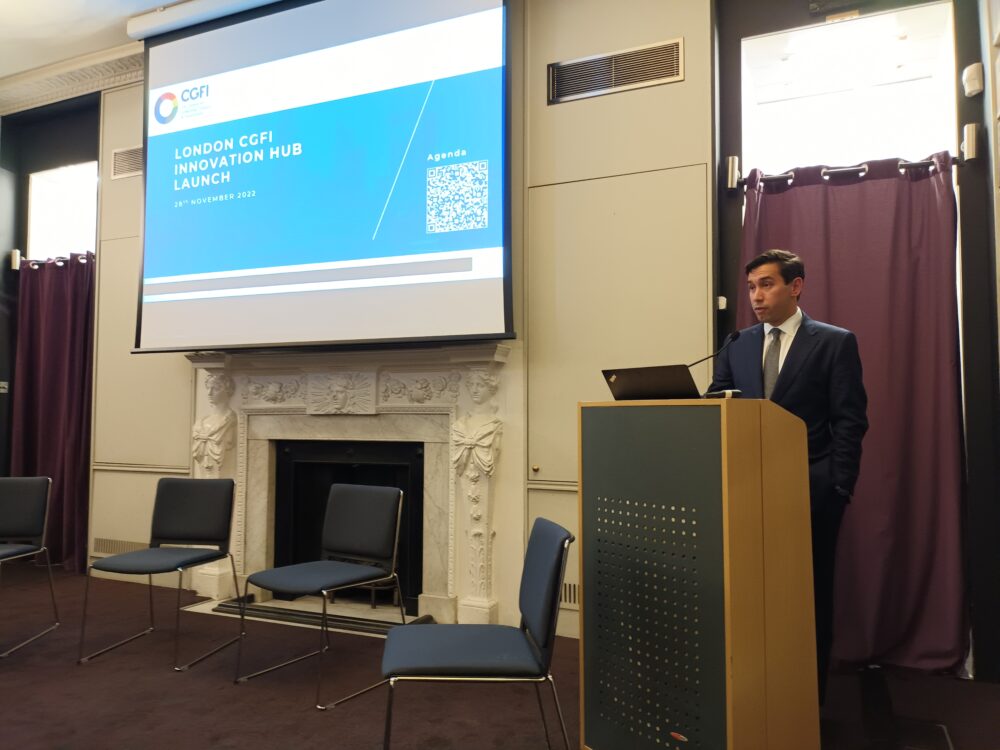 Ben Caldecott on stage giving a presentation at The Hub launch.